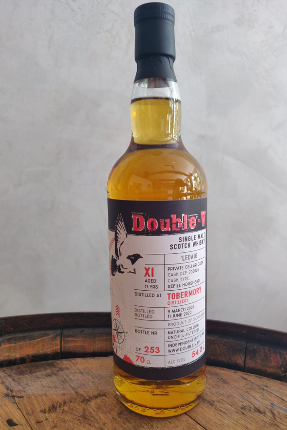 Double V whiskey bottle with tobermory grunge label in red, white and black